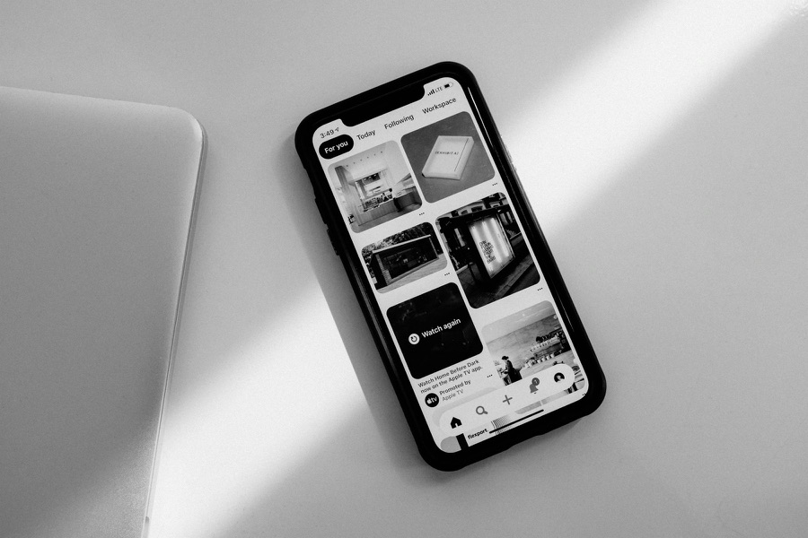 A smartphone lying on a desk showing an app screen